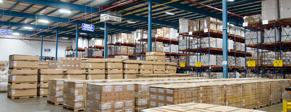 crowe warehouse with pallets of goods